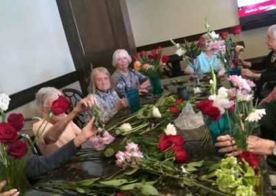 seniors create floral arrangements