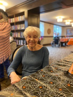 portrait of elderly woman at Halloween table